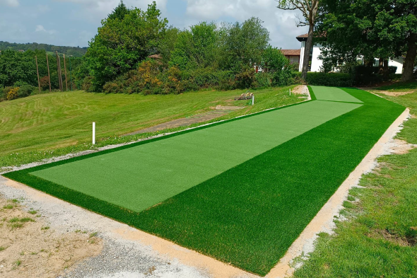 Los Angeles and Southern California Outdoor tee line consisting of one continuous green synthetic grass strip surrounded by trees